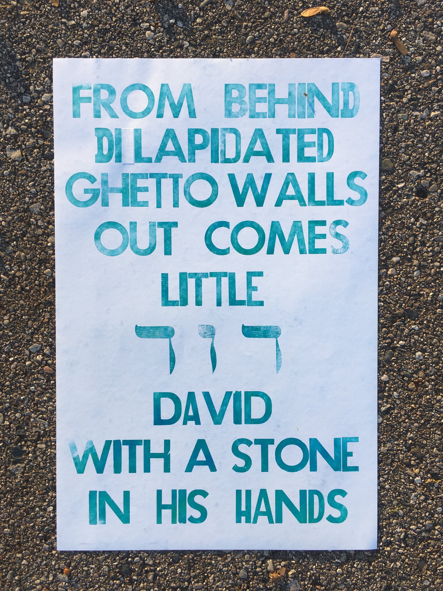 FROM DILAPIDATED GHETTO WALLS OUT COMES LITTLE דוד  DAVID WITH A STONE IN HIS HANDS